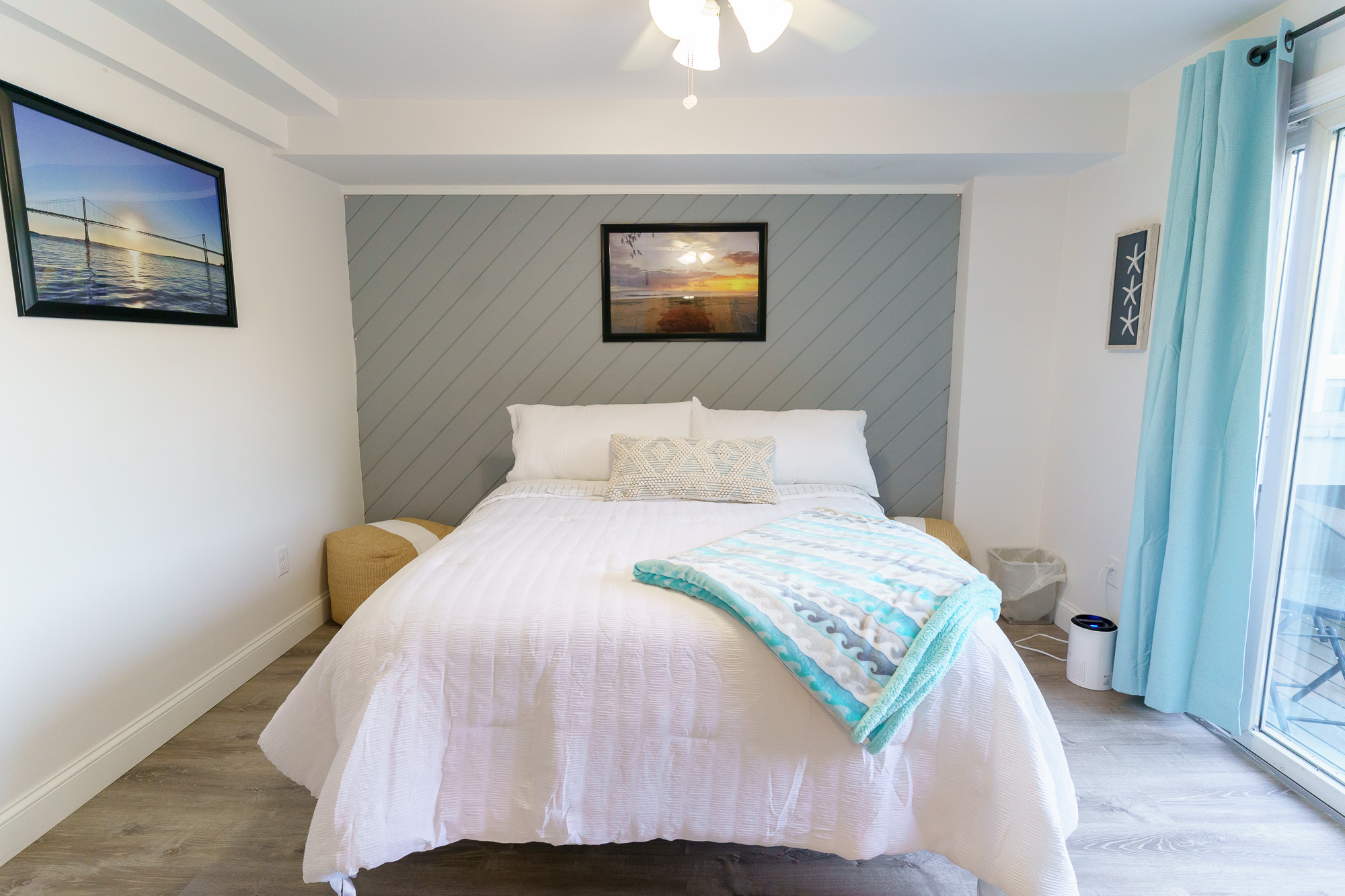 Coastal bedroom staged for a short-term rental listing in Hampton Roads, Virginia