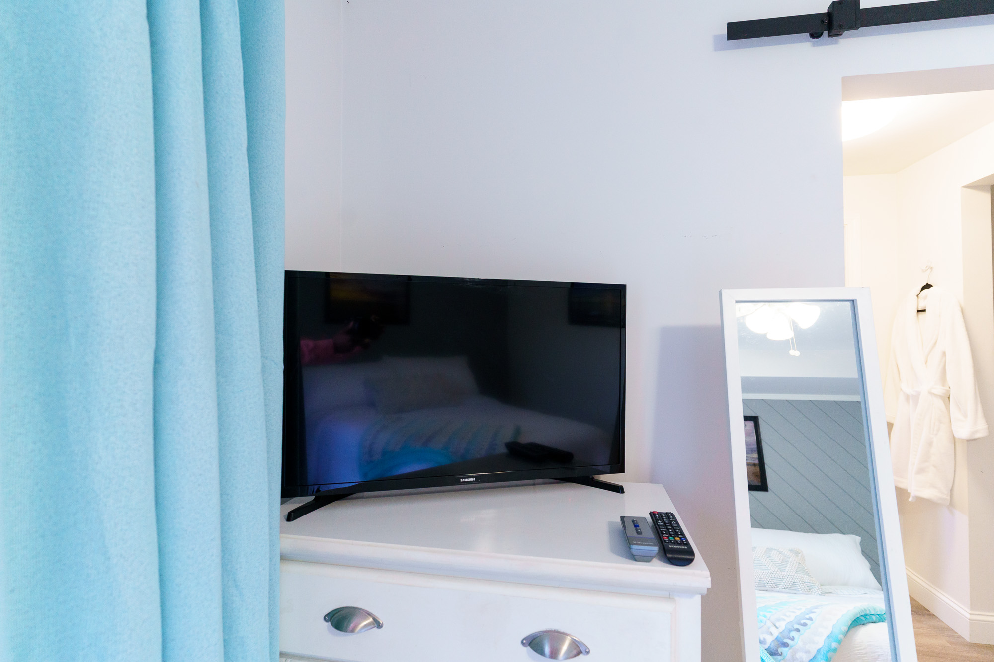 Wall-mounted television in the bedroom