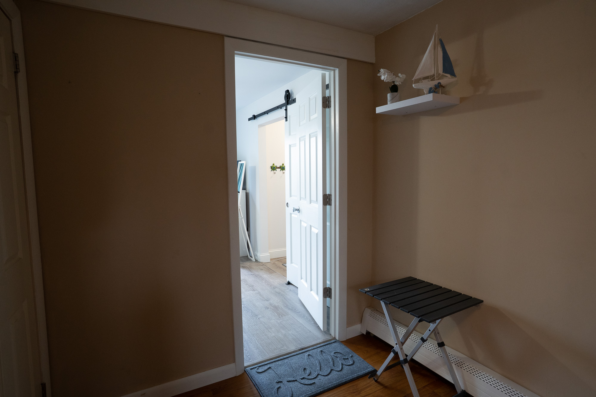 Entry mudroom nook with decorative shelf