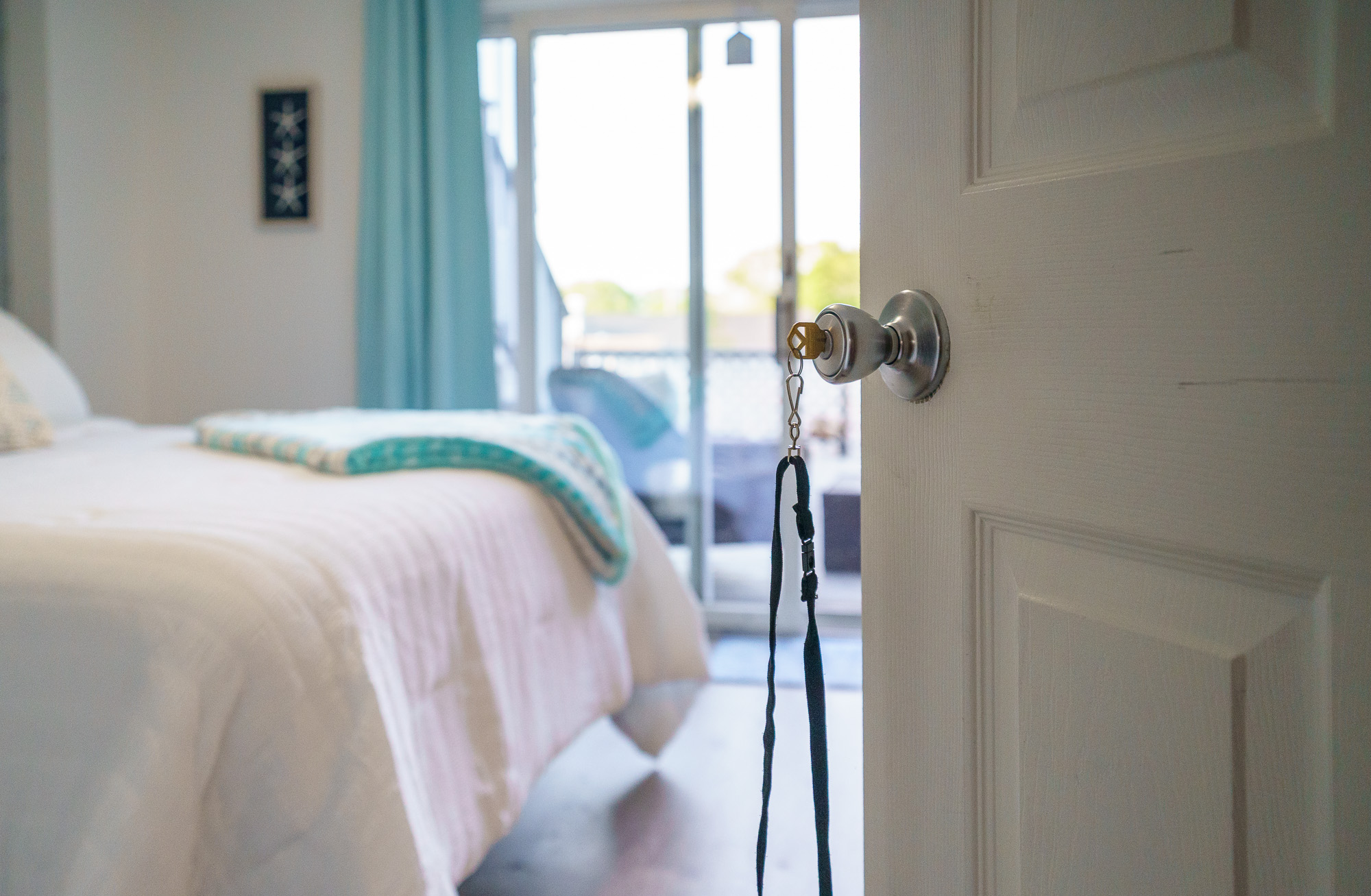 View from the bed toward the open balcony door
