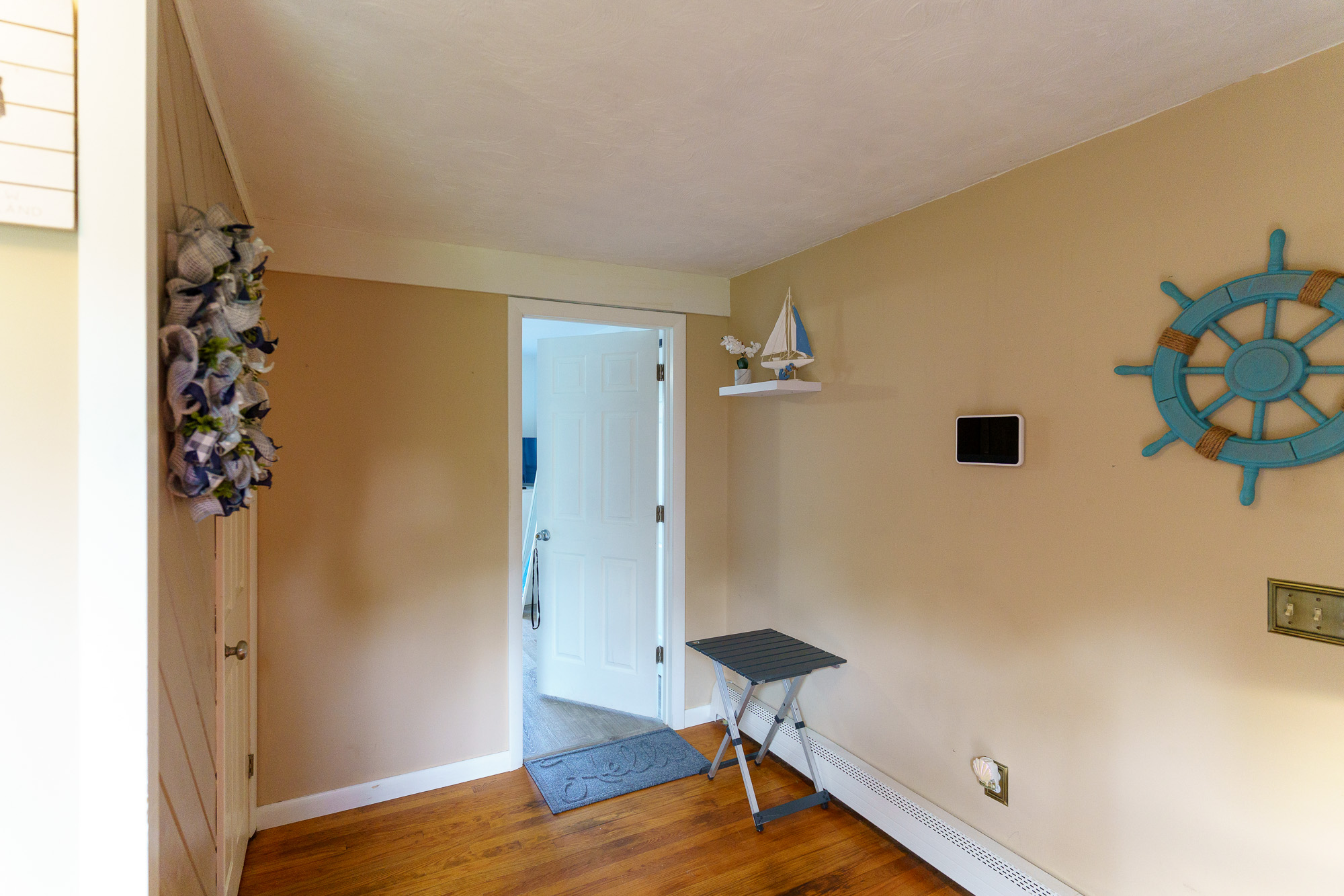 Entryway with nautical decor and thermostat