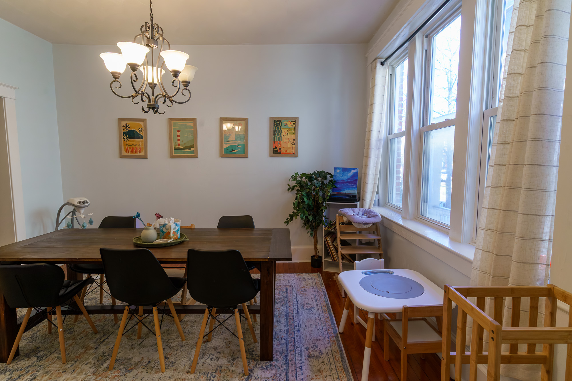 Dining room with wood table and gallery wall