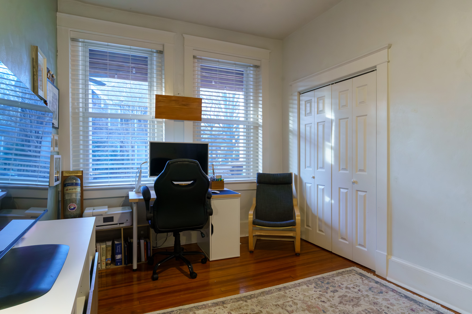 Full view of the home office desk and seating